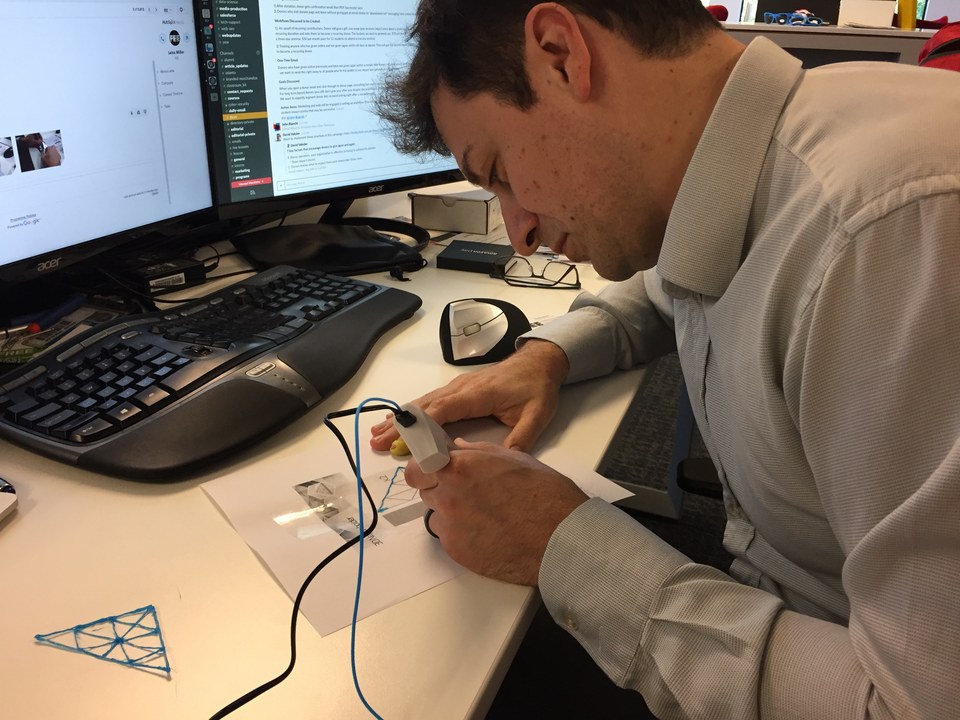 David Veksler working with a connected device at his desk